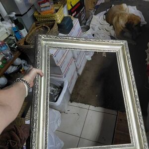 baroque-style frame with a gilded antique finish.  27" X 25" X 2"